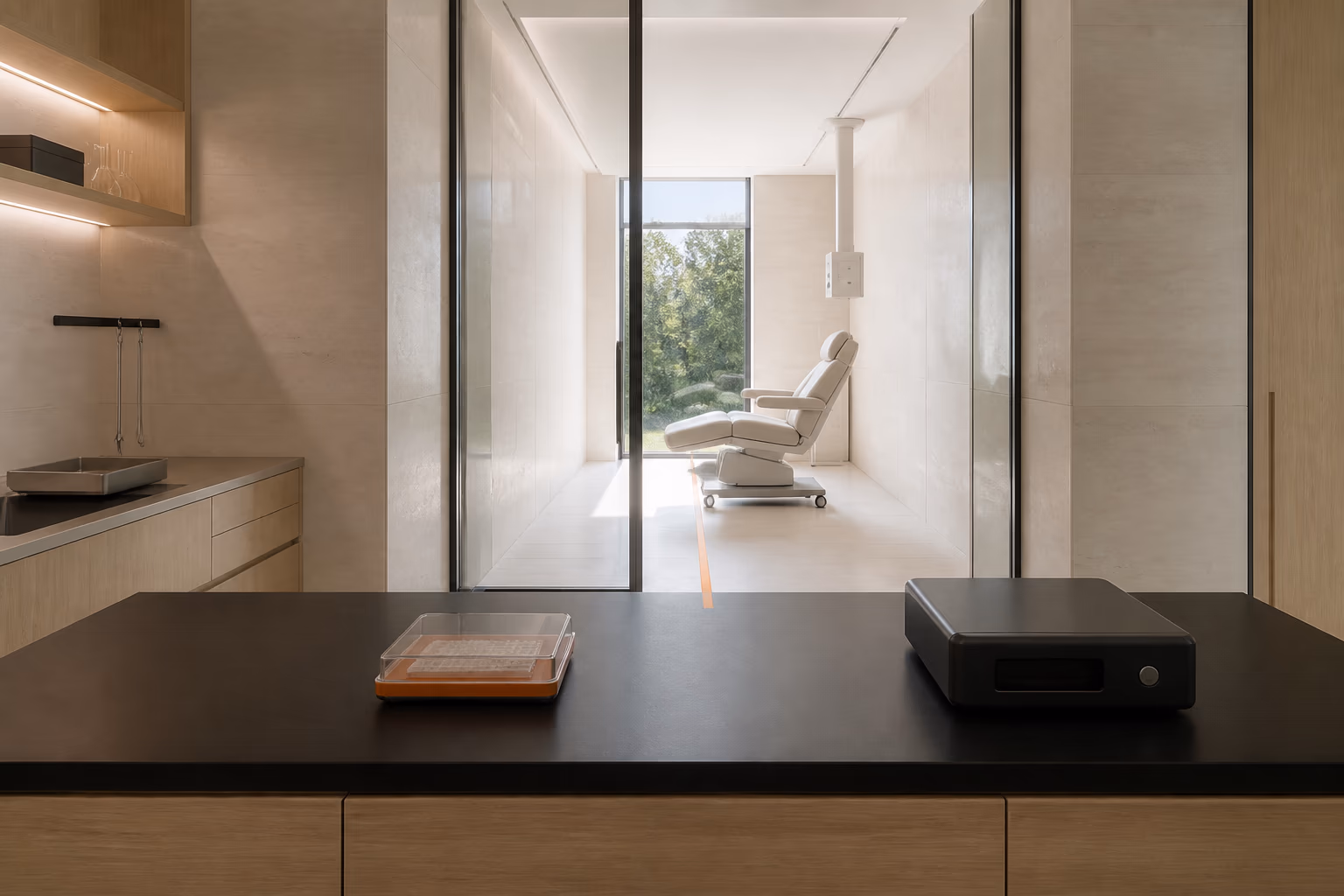 A research bench connected through glass to a treatment room.